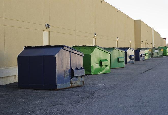 bright yellow construction dumpster full of discarded materials in Basin City, WA